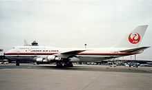 Side view of aircraft on airport tarmac.