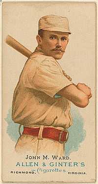 A baseball card showing a man holding a baseball bat over his left shoulder.