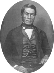 Hawaiian man in western Victorian formal suit