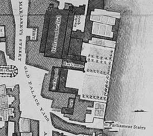 The Old Palace was a complex of buildings, separated from the River Thames in the east by a series of gardens. The largest and northernmost building is Westminster Hall, which lies parallel to the river. Several buildings adjoin it on the east side; south of those and perpendicular to the Hall is the mediaeval House of Commons. Further south and parallel to the river is the Court of Requests, with an eastwards extension at its south end, and at the south end of the complex lie the House of Lords and another chamber. The palace was bounded by St Margaret's Street to the west and Old Palace Yard to the south-west; another street, New Palace Yard, is just visible to the north.