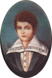 Half-length portrait of a boy with light hair and wearing a jacket over a shirt with an enormous, embroidered collar.