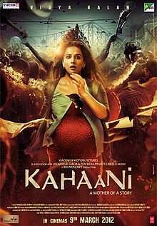 Theatrical release poster depicts a pregnant woman, looking sightly surprised, standing. The city of Kolkata, during Durga Puja, is in the background. Text at the bottom of the poster reveals the title, tagline, production credits and release date.