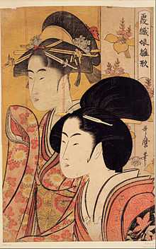 A colour print of a closeup of the head and upper torso of a finely dressed Japanese woman.  Behind her is a bamboo screen on which is depicted a similar woman's head and upper torso.