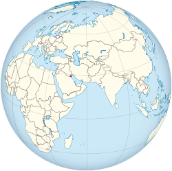 Location of  Kuwait  (red)in the Arabian Peninsula  (light yellow)