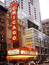 The marquee in front of a theatre, advertising that night's performance.