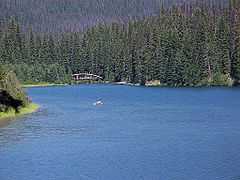 Lightning Lake with a canoe in the distance.