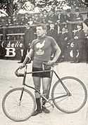 A picture of Louis Darragon beside his bike.