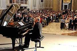 Colour photograph of Ludovico Einaudi performing live in 2008.