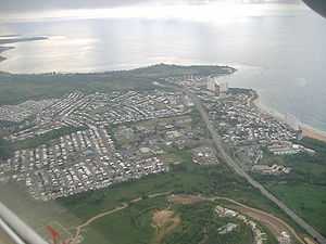 Aerial view of a coastal city from inland