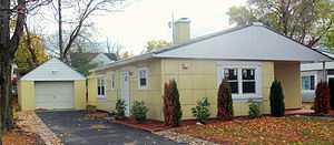 A similar house and garage in yellow