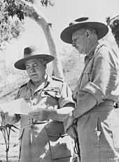 Two soldiers in khaki uniforms and slouch hats.