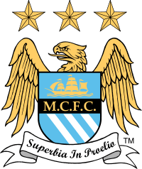 A badge depicting a shield with an eagle behind it. On the shield is a picture of a ship, the initials M.C.F.C. and three diagonal stripes. Below the shield is a ribbon with the motto "Superbia in Proelia". Above the eagle are three stars.