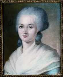 Portrait of a woman, showing her head, with a grey wig. Two large curls are sitting at the nape of her neck. Her shoulders are covered with a filmy, cream-coloured shawl.