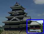 A one-storied structure with a veranda with red handrail connected to a two-storied castle tower. Both are located on a platform of unhewn stones.