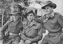 Three men posing for a photograph wearing British Army uniform