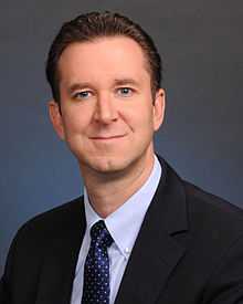 Head and shoulders of a Caucasian man wearing a suit