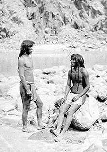 A black and white photograph of two Mohave men next to the Colorado River, 1871