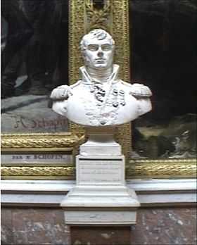 Bust of man with a dimple on his chin. He wears an early 1800s military uniform with high collar.