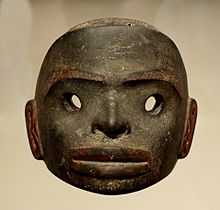 A dark stone mask, free standing