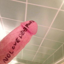 A photograph of male genitalia, with the words "NO LOVE DEEP WEB" written on it.