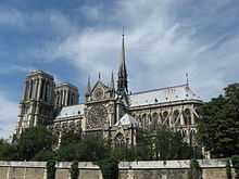 Notre Dame, Paris, is a grand Gothic cathedral with Towers at one end and a small spire rising from the centre of the roof.