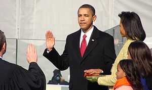 Barack and Michelle Obama, their children, and Chief Justice John Roberts.