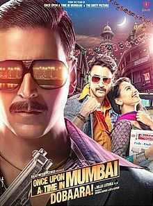 The bust of the title character, Shoaib Khan wearing Black full frame sunglasses consisting the reflection from streetlights dotting the coast line of the city and Black suit and Purple and Violet stripped shirt underneath holding a gun in his hand occupies a significant portion of the poster, mostly left and lower-front. In this case the city being Mumbai or Bombay as it was known, in the period which the film is set in. The other male lead of the film facing front wearing denim jacket, saffron shirt and stylised Sunglasses holding his shirt-collar up with a woman breaking into laughter resting on his chest looking upwards. The backdrop consists of verendah's of chawls of Mumbai and a waxing crescent moon in the sky. The title logo of the film and credits below.