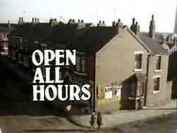 1976 title card. The series title appears over an aerial shot of the corner shop.