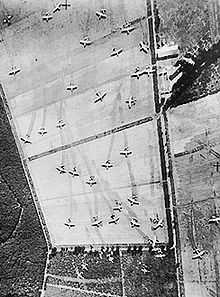 Aerial view of fields covered in abandoned gliders