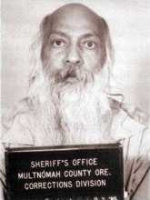 Mug shot of older, bald man with white beard