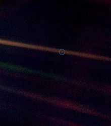Pale blue dot image with a wider field of view to show more background