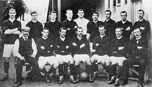 A group of footballers posing for a team photograph.