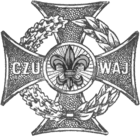 A Maltese cross with a wreath, the left half of oak and the right half of laurel leaves.; a circle at the center with rays like the sun and the Scouting fleur-de-lis; the arms bear C Z U and W A J— czuwaj is Polish for watch, the Polish Scout motto.
