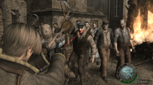 An image of a young man defending himself against a hoard of humanoid enemies in a village setting. The camera is behind the man's shoulder, placing him in the bottom left corner and the attackers in the background of the picture.