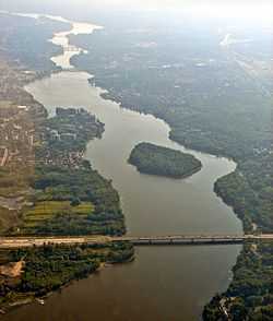 Aerial view of Rivière des Prairies with Louis Bisson Bridge in the foreground. The island "Ile aux Chats" can be seen near the center.