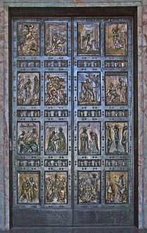  A pair of bronze doors divided into sixteen panels containing reliefs depicting scenes mainly from the life of Jesus and stories that he told.