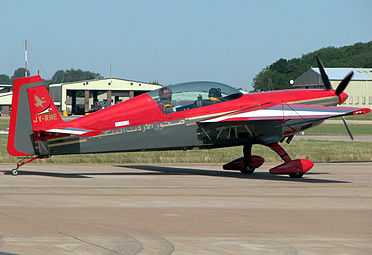 A small aircraft taxying at an airshow