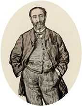informal portrait of man in early middle age with his hands in his trouser pockets