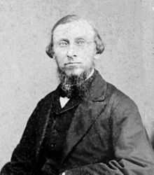 Nineteenth century black-and-white photograph of Samuel Merrill Woodbridge, a man in suit, dress shirt, and tie