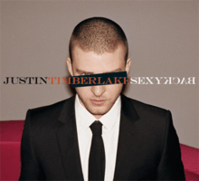 A young man with a buzz cut, wears a two-piece black suit, with a white shirt and black tie. A black horizontal rectangle covers his left eye, while his right blue eye can be seen. In capitals, "Justin", "Timberlake", and "SexyBack" is written in black, orange, and white font, respectively. The word "Back" is spelled backwards.