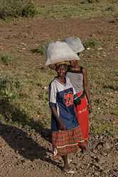 Shaba Kenya women carrying sacks.jpg