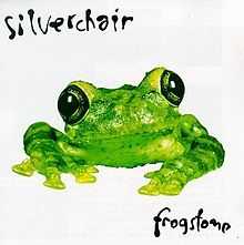 A photo of a green frog in front of a white background, with "Silverchair" written above and "Frogstomp" written below it in a handwritten-style font.