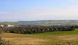 Modern photograph of the site of the Battle of Lewes 1264. The battle was fought between Simon de Montfort and Henry III in the field in the foreground with the former being victorious. Lewes castle and Southerham chalk pits to the left and Beddingham Hill behind it with the town of Lewes.