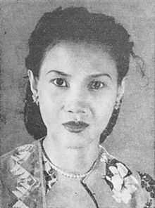 A black and white portrait of a woman.