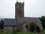 A church with a tall church tower positioned centrally.