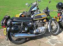 Yellow-and-black motorcycle, parked with others