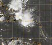 A disorganized mass of thunderstorms over Puerto Rico and the Dominican Republic. The image depicts most of the eastern Caribbean and the surrounding landmasses.