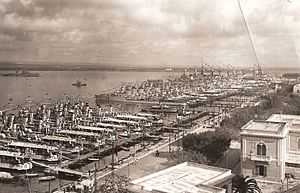 Several ships stern on to dockside