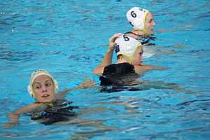 three women in a pool.