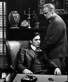 A screenshot of Michael and Vito Corleone during The Godfather.